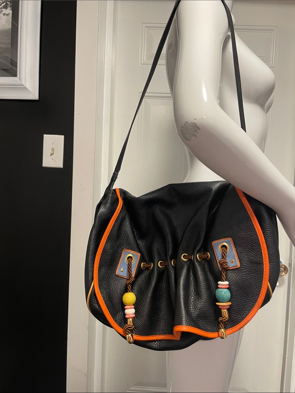 Black Pebbled Vampiro Shoulder Bag with Orange Trim and Beaded Accents